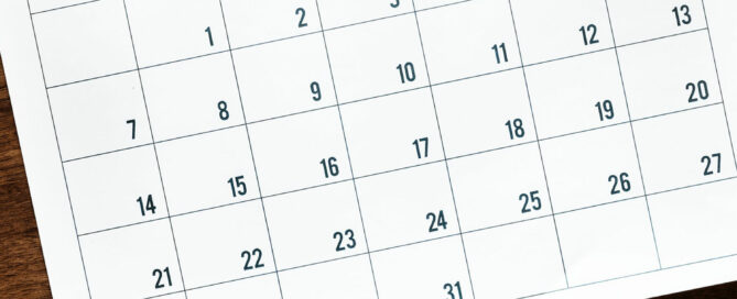 Photo of a calendar laying on top of a desk