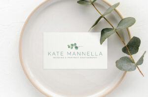 Overhead photo of the new Kate Mannella Photography logo on a business card